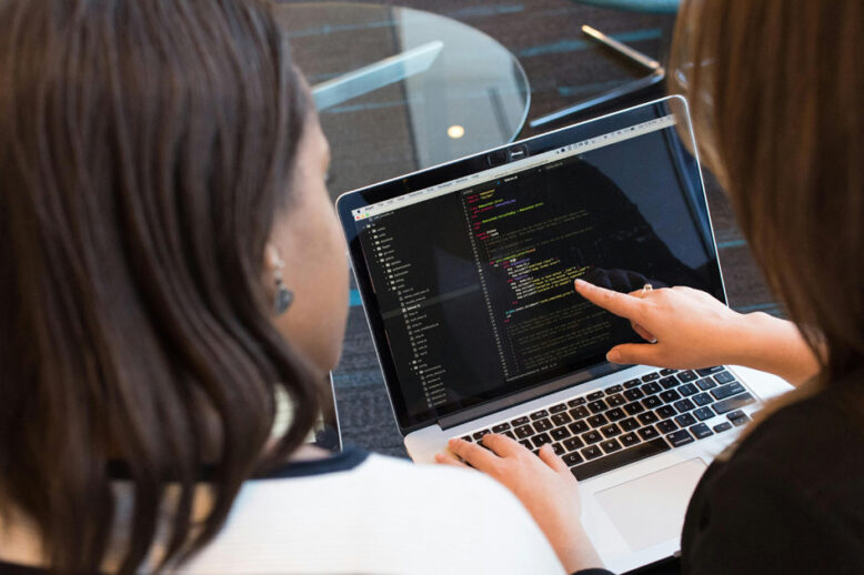 Two women discussing IT Consulting for Secure-Net